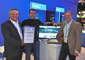 CEO Tom Tabor presenting the award to UberCloud HPC Co-Founders Burak Yenier and Wolfgang Gentzsch