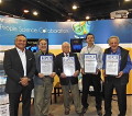 Tom Tabor presenting the awards to PSC Founder and Co-Scientific Director Michael Levine, Nathan Stone, Sr. Research Analyst, and Director Ralph Roskies