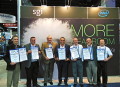 Executive and product teams from SGI and Total accepting their awards from Tom Tabor
