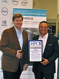 Tim Carroll, director, Dell HPC accepting the Top Supercomputing Acheivement Award from TCI CEO Tom Tabor