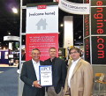 Tom Tabor presents Univa CEO Gary Tyreman and VP of Sales Rob Secontine with their award