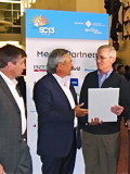 DDN EVP and CTO Jean-Luc Chatelain looks on as CEO Tom Tabor presents British Petroleum's Manager for HPC Keith Gray with the award