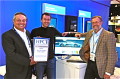 Tom Tabor presenting the award to UberCloud HPC co-founders Burak Yenier and Wolfgang Gentzsch