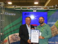 HPCwire and TCI CEO and Founder Tom Tabor presenting Kitware Dir. Scientific Computing Berk Geveci the award