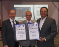 Jim Scapa, CEO, and James Brancheau, CTO of Altair accepting awards from Tom Tabor