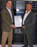 Drew Schlussel, EMC's Director of Product Management for VNX Unified Storage is all smiles as he accepts the ECA award from Tom Tabor for