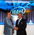 Eric Barton, former CTO of Whamcloud and Lead Architect, High Performance Data Division at Intel is congratulated by Tom Tabor, CEO and Founder, HPCwire and Tabor Communications Inc.