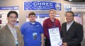 CHREC Team - Dr. Herman Lam, Carlo Pascoe and Dr. Alan George receiving the award from Tom Tabor