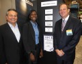 Danika Alston and Herb Schultz of IBM accepting the award from Tom Tabor