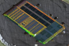 Close-up of light-enabled microprocessor showing optical circuits (left), memory (top) and 2 compute cores (right)