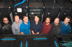 Members of the commissioning team—(from left to right) Imran Latif, David Free, Mark Lukasczyk, Shigeki Misawa, Tejas Rao, Frank Burstein, and Costin Caramarcu—in front of the newly installed institutional computing cluster at Brookhaven Lab’s Scientific Data and Computing Center. 